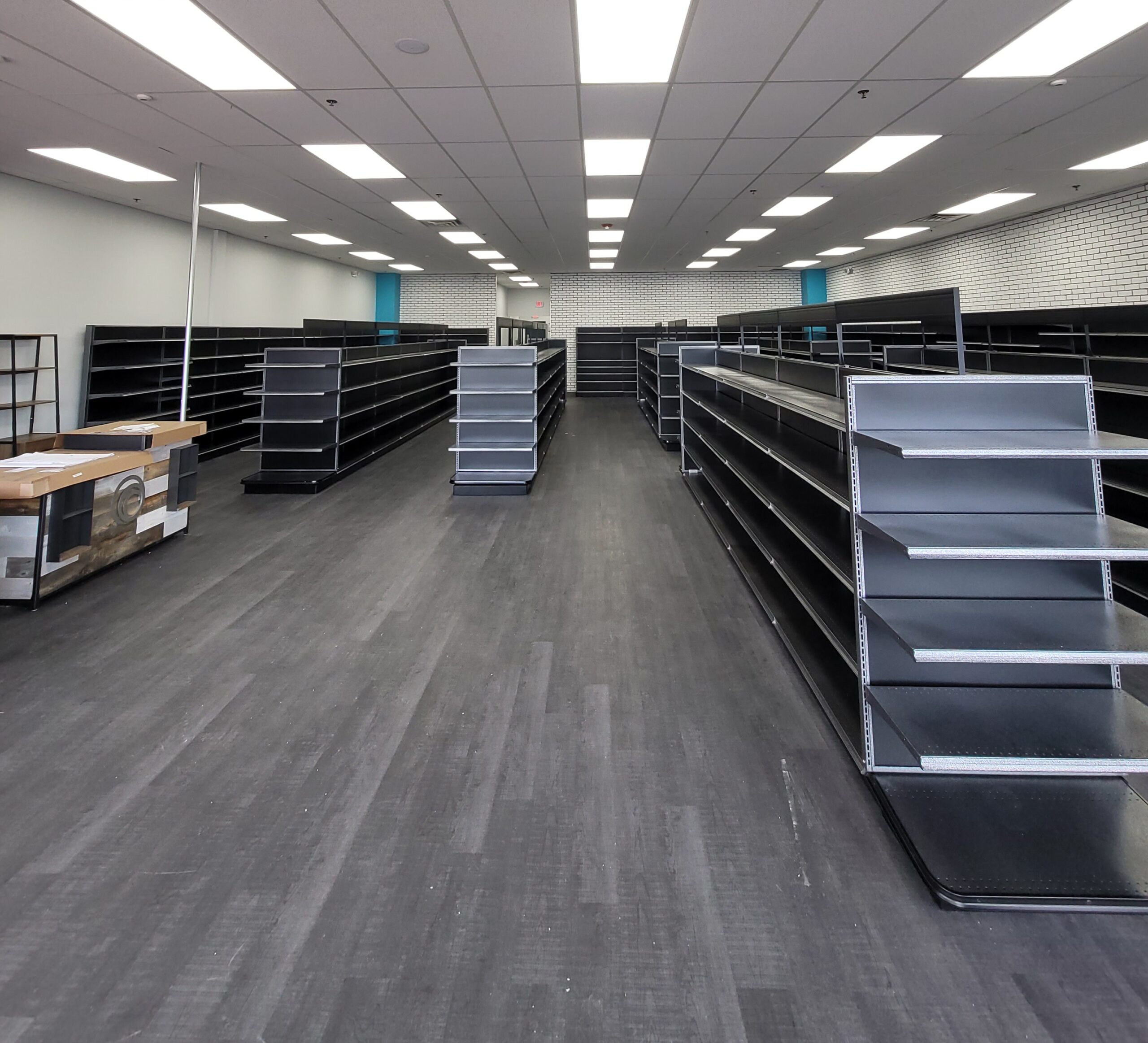Newly wired retail store interior in Connecticut featuring LED lighting, conduit, and power installation by Prevolt Electric commercial electricians.