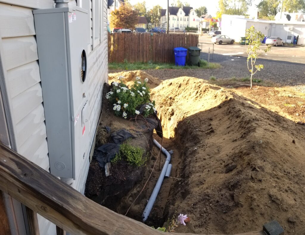 Licensed electricians installing underground conduit in Connecticut and Massachusetts