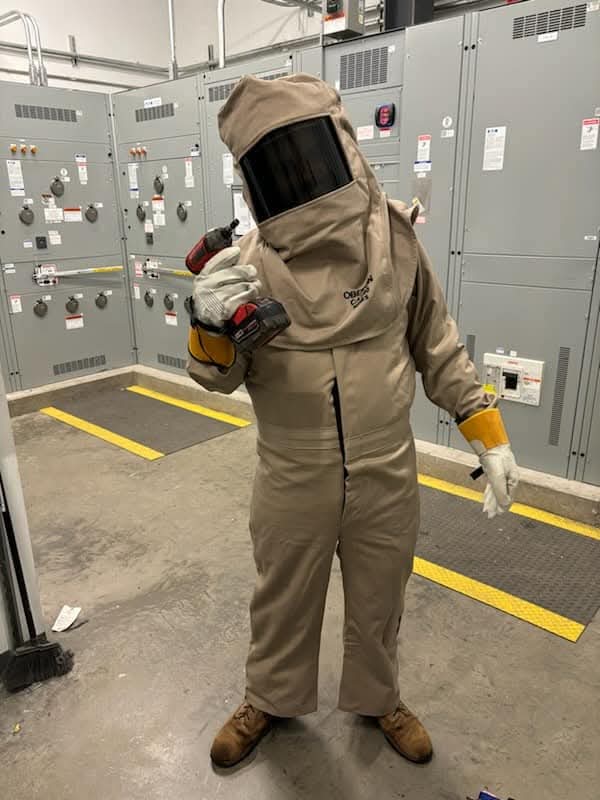 Prevolt Electric technician inspecting electrical panel and power distribution equipment during a professional evaluation.
